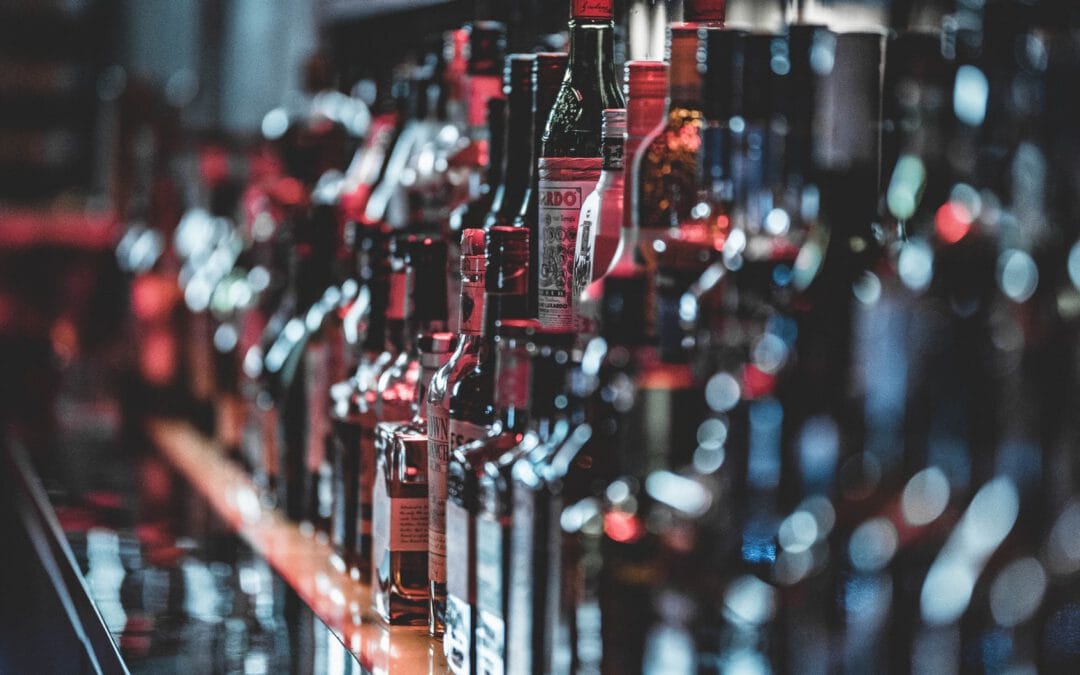 selective focus photo of alcohol bottles