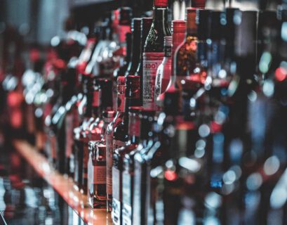 selective focus photo of alcohol bottles