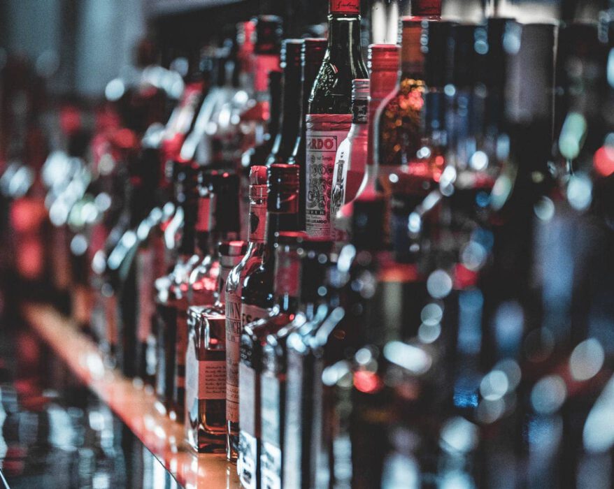 selective focus photo of alcohol bottles