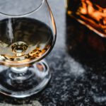 close up photo of brown liquor in a glass