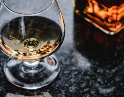 close up photo of brown liquor in a glass