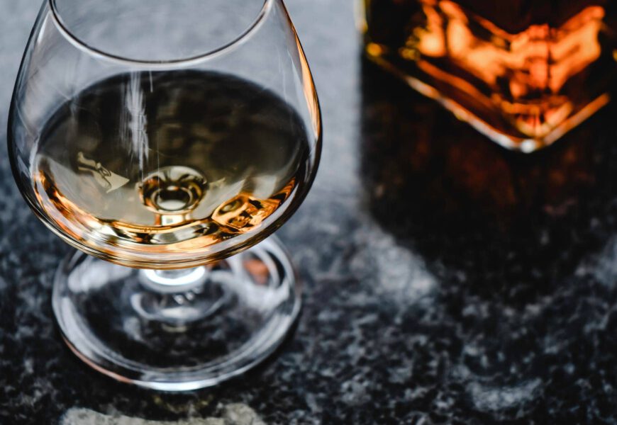 close up photo of brown liquor in a glass