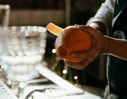 person holding bread with butter filling