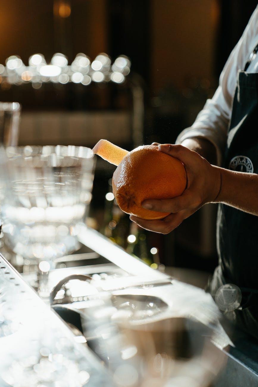 person holding bread with butter filling